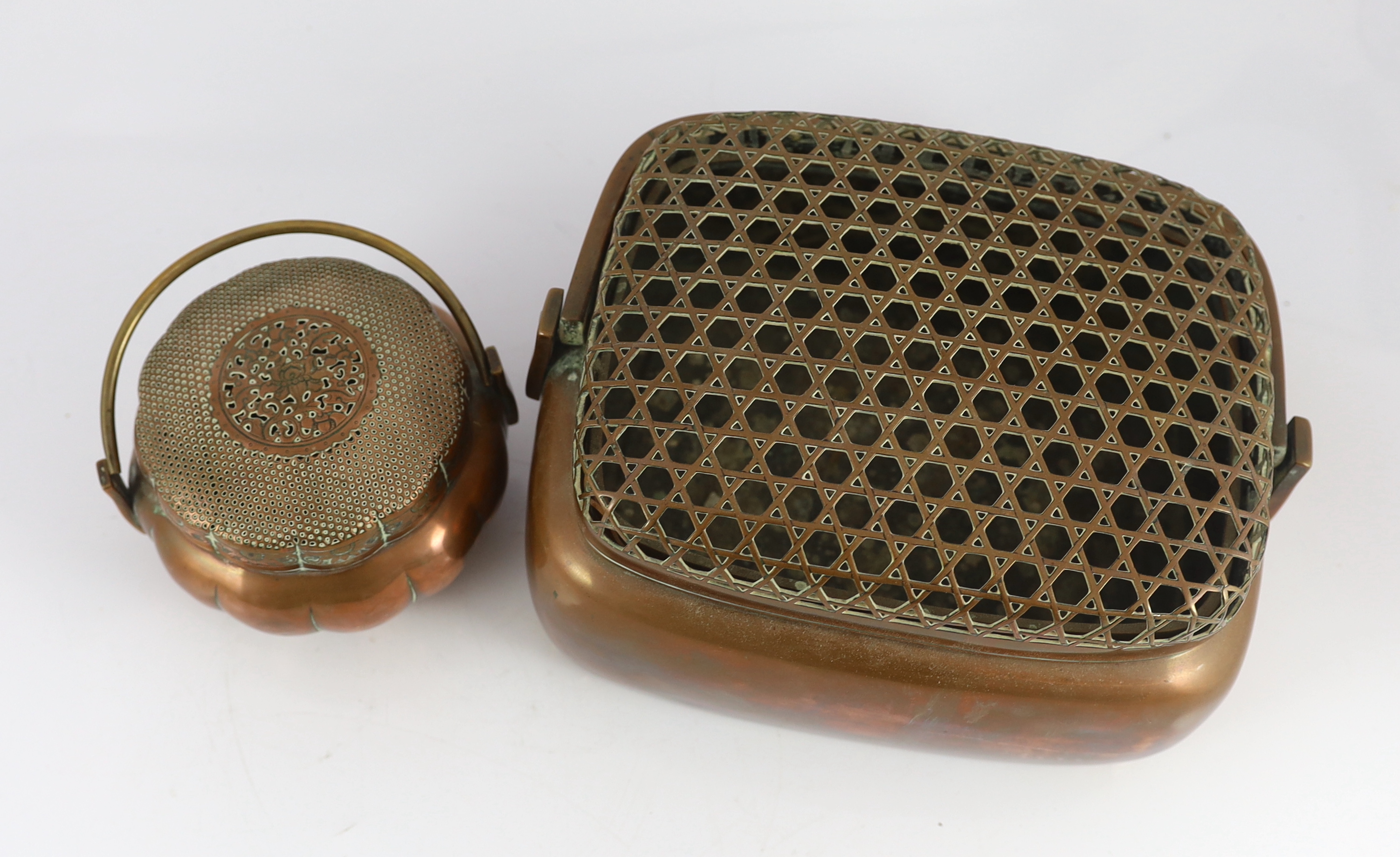 Two Chinese copper hand warmers, the largest signed ‘Zhang Mingqi', 18th/19th century